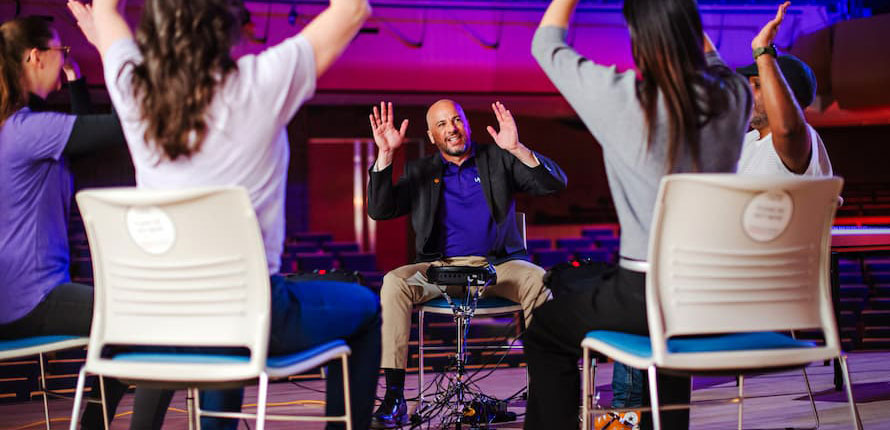 A professor leading a music workshop